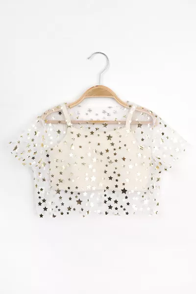 توب قصير شيفون بناتي بلون عاجي مطبوع بالنجوم