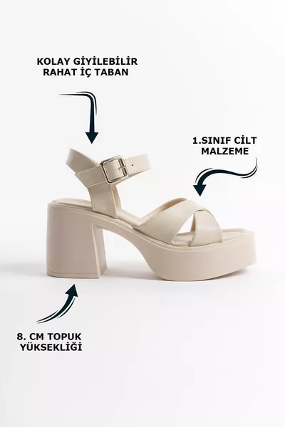 صندل نسائي صيفي من الجلد بلون كريمي مع أشرطة متقاطعة ونعل مبطن وإبزيم جانبي عالي ومقدمة مفتوحة