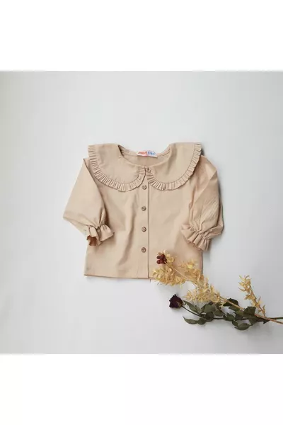 Maglietta per neonata con collo a volant