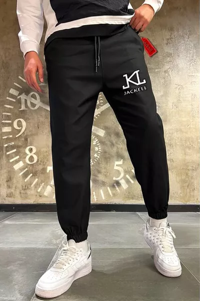 بنطال رياضي أسود ضيق للجنسين من أكاديمية Wwl مع حزام مطاطي وكاحل مطبوع