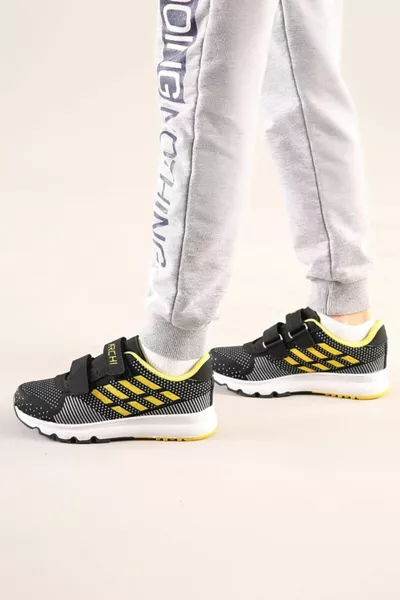 أطفال أسود-أصفر التشريحية وحيد أحذية رياضية عارضة