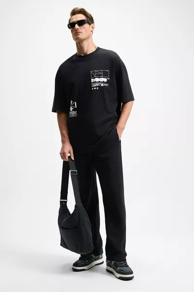 بنطال رياضي رجالي أسود من DOTTI، خصر مطاطي مع حبل، جيوب جانبية، مقاس فضفاض