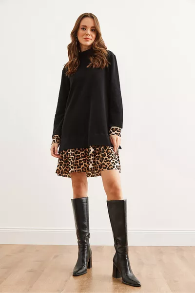 Damenkleid aus Spitzenstoff mit schwarzem Leopardenbesatz 