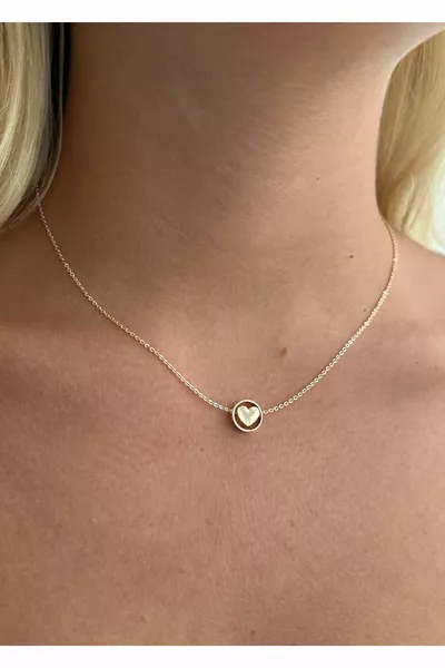 MINIMUM GOLD ROTATING HEART NECKLACE