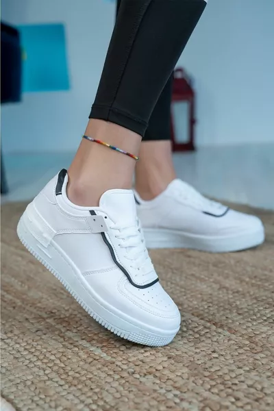 حذاء رياضي أبيض أسود نسائي