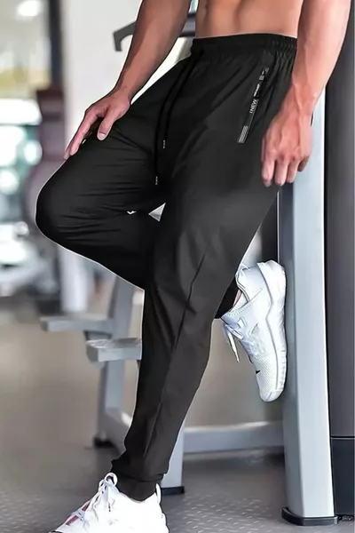 بنطال رياضي للجري والتدريب للرجال بتفاصيل سحاب من نيو سبورت