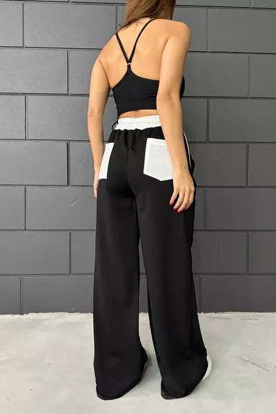 Schwarze, weiße Oversize-Jogginghose mit weitem Bein und Gürtel für Damen