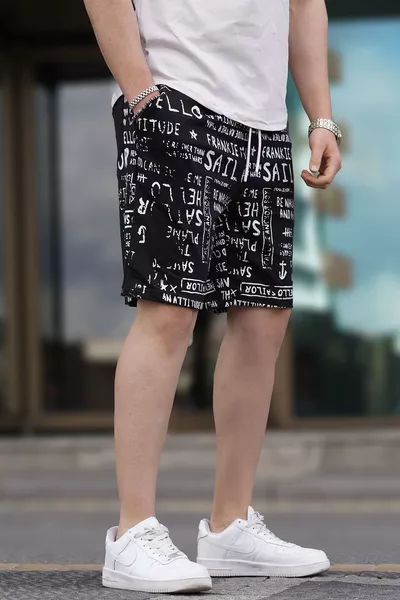 Schwarze Caprihose mit Aufdruck 