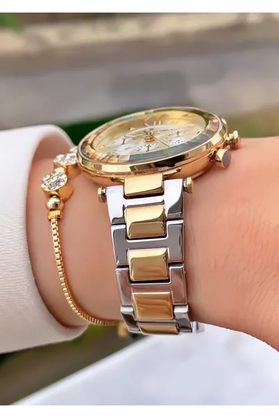 ساعة نسائية باللون الفضي الأصفر من ماركة، بضمان سنتين - مع سوار هدية