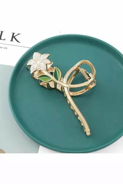 Pince à ressort en métal doré avec fleurs de lys blanches 