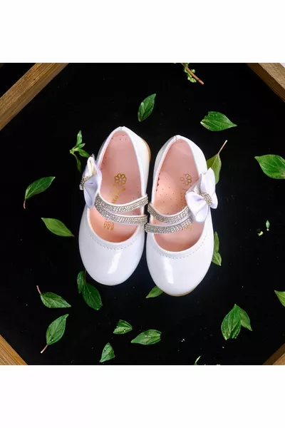 Witte meisjesballetjes met dubbele stenen en klittenbandstrik