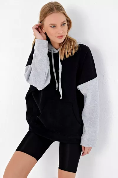 Sweat-shirt à capuche surdimensionné de couleur noire pour femmes 