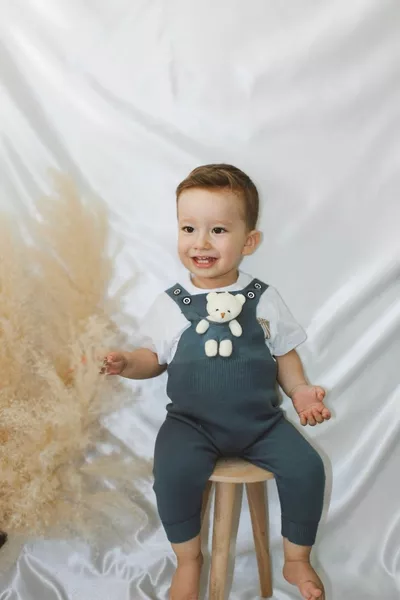 Salopette en tricot pour bébé et enfant avec boutons et ourson Indigo