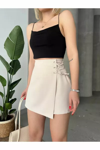 Женская ткань габардин кремовая деталь с высоты птичьего полета элегантная юбка