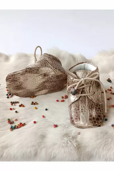 Bronzen bedrukte echt lederen babyslofjes