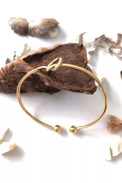 Bracciale a polsino da donna con nodo placcato in oro