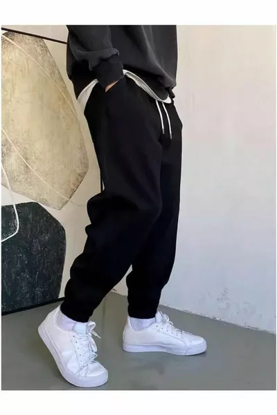 Pantaloni della tuta neri con fondo elastico, vestibilità regolare unisex