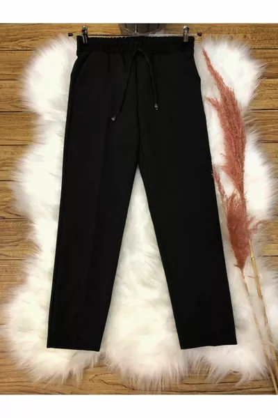Lucia Pantalon femme en tissu élastiqué à la taille avec poche coupe carotte détaillée