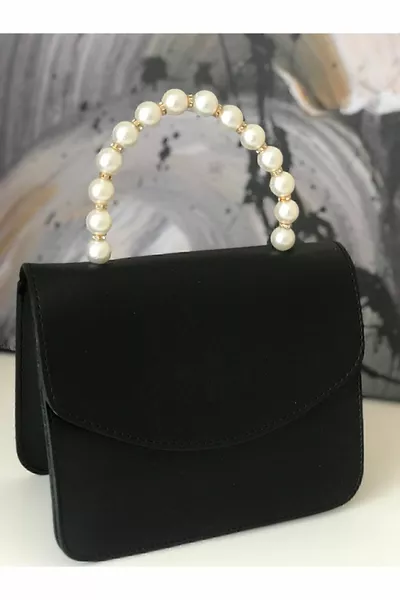 Borsa a tracolla e a mano da donna con perla nera e catena