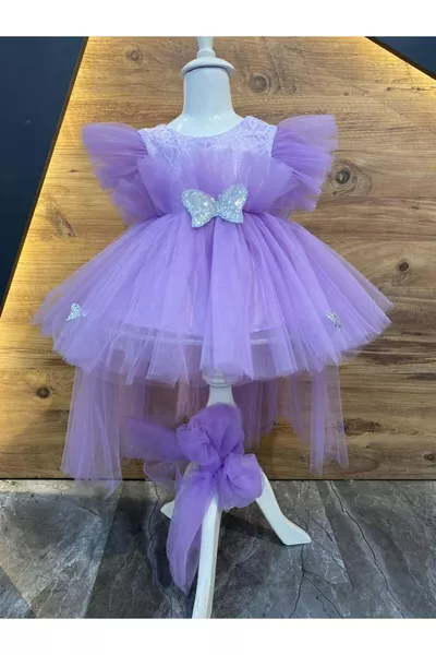 فستان بنفسجي لمولودة بفتاة بأجنحة ملاك عمرها 6 أشهر