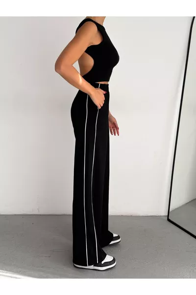 بنطال رياضي نسائي واسع الأرجل من القماش المودال، مزود بجيوب مزدوجة وخطوط بيضاء على الجانبين