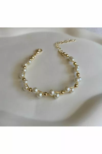 سوار نسائي بتفاصيل لؤلؤية وكرة ملفوفة