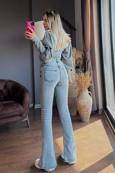 Jeans mit Snow-Wash-Effekt, hoher Bund, elastisch, Schlaghose, mit vorderem Schlitz, Damenjeans