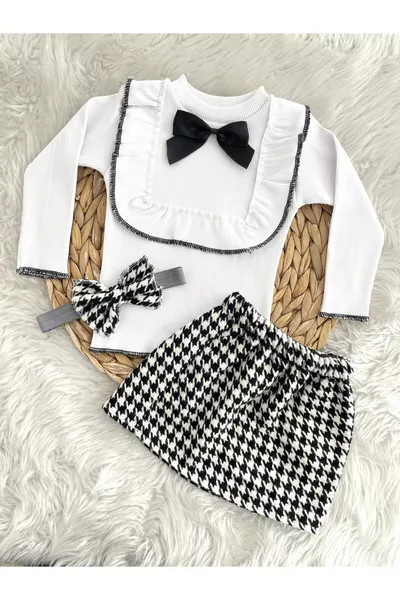 طقم بنت مكوّن من تنورة على شكل فيونكة وجاكيت ورباط رأس