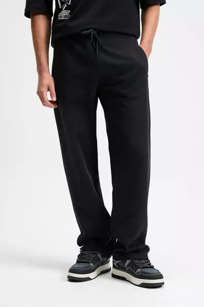 بنطال رياضي رجالي أسود من DOTTI، خصر مطاطي مع حبل، جيوب جانبية، مقاس فضفاض