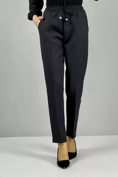 Pantalon femme taille élastique en tissu léger coupe carotte longueur cheville