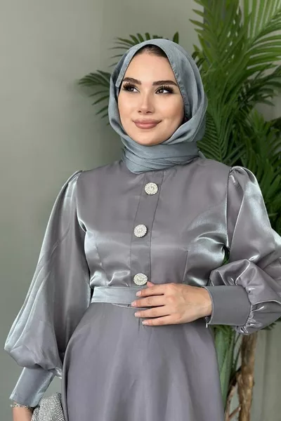 Avondjurk met drie knopen met ballonmouwen grijs