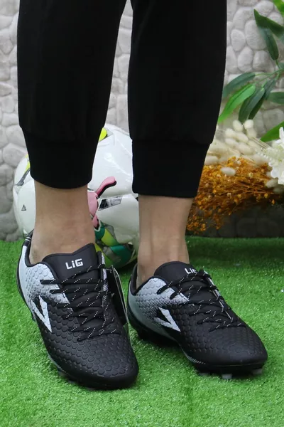 Produit : Terrain en herbe, Astroturf, Chaussures de football, Chaussures de football