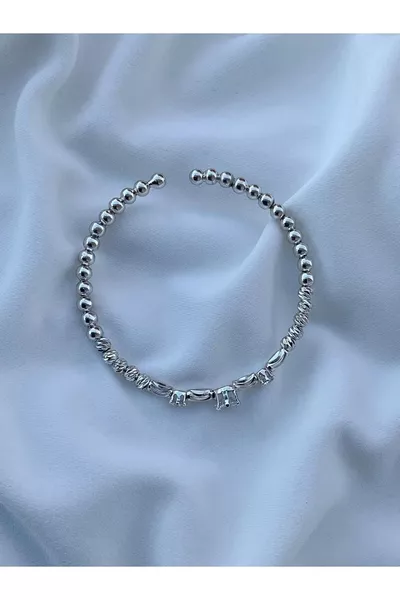 Женский браслет Dorika с сердцем и камнями серебристого цвета