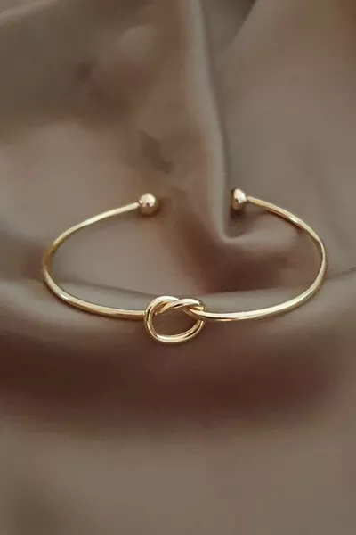 Bracciale a polsino da donna con nodo placcato in oro
