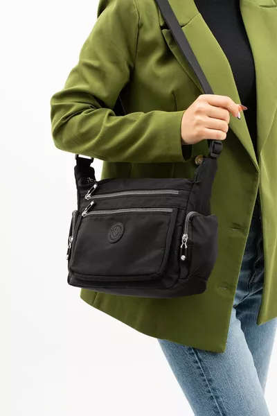 حقيبة كتف نسائية مقاومة للماء من قماش كرينكال، سوداء اللون، مزودة بأحزمة قابلة للتعديل للارتداء على الكتف بشكل متقاطع