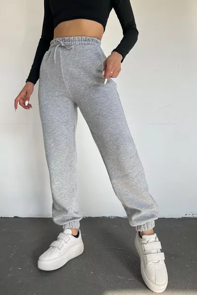 Pantaloni della tuta da donna grigi invernali, spessi, foderati in pile, vita alta, fondo gamba con elastico, jogger basic
