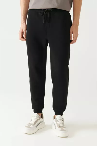 Herren Schwarze Jogginghose aus elastischer Baumwolle mit Schnürbein 