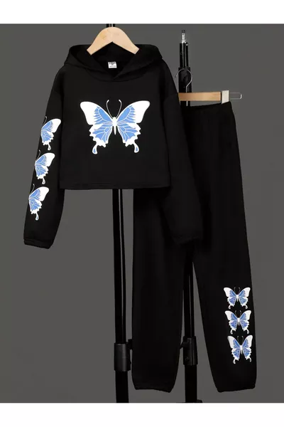 white tracksuit with black child butterfly print