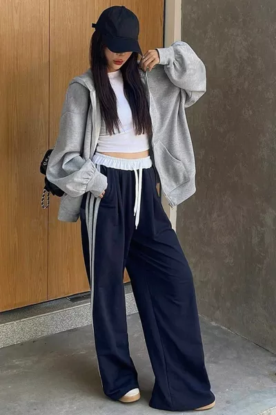 Damesgrijze trui met capuchon en ritssluiting