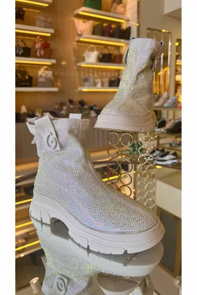 المرأة المستوردة تمتد النسيج أحذية الحجر