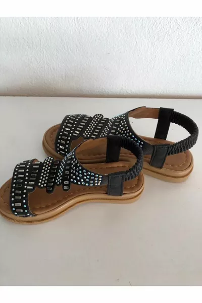 Sandali da ragazza con suola piatta in pietra nera