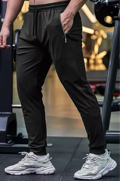 بنطال رياضي للجري والتدريب للرجال بتفاصيل سحاب من نيو سبورت