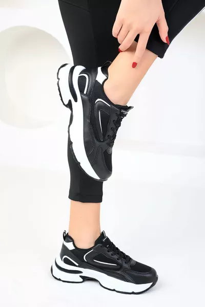 حذاء نسائي رياضي أسود وأبيض 