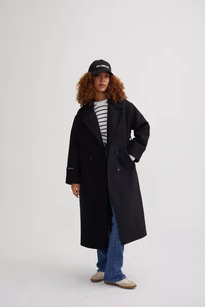 معطف صوفي نسائي واسع الحجم بتصميم أكمام مفصلة باللون الأسود