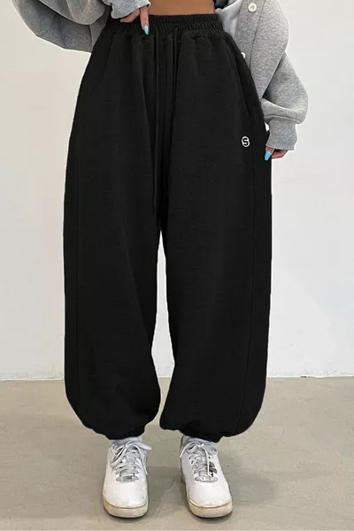 بنطال رياضي نسائي فضفاض من قطعتين باللون الأسود