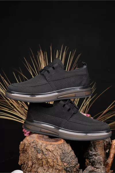 جلد طبيعي للرجال + حذاء أسود من القماش النموذج الذي يوفر الأناقة والراحة جنبا إلى جنب مع أسلوبه المبتكر