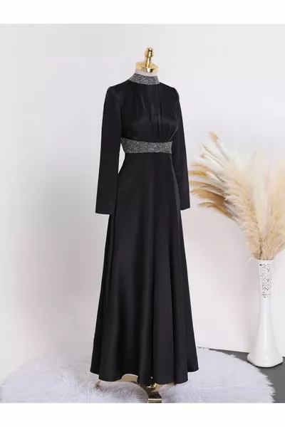 Satin evening dress with stone detail at the collar and waist