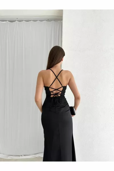 Corset-shaped midi black dress with low back and deep slit and thin straps