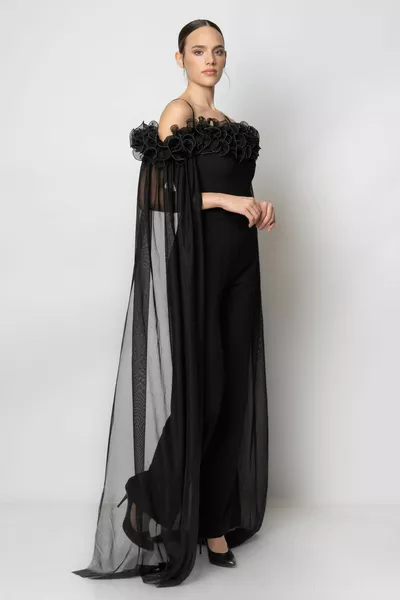 Crepe evening dress jumpsuit with tulle piece on the sleeve with bibila collar