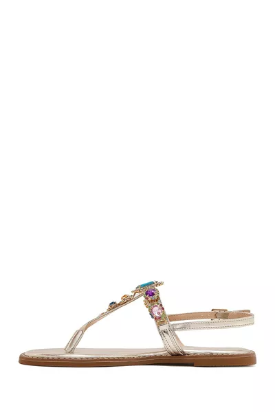 صندل نسائي بين الأصابع مزين بحجر ذهبي 